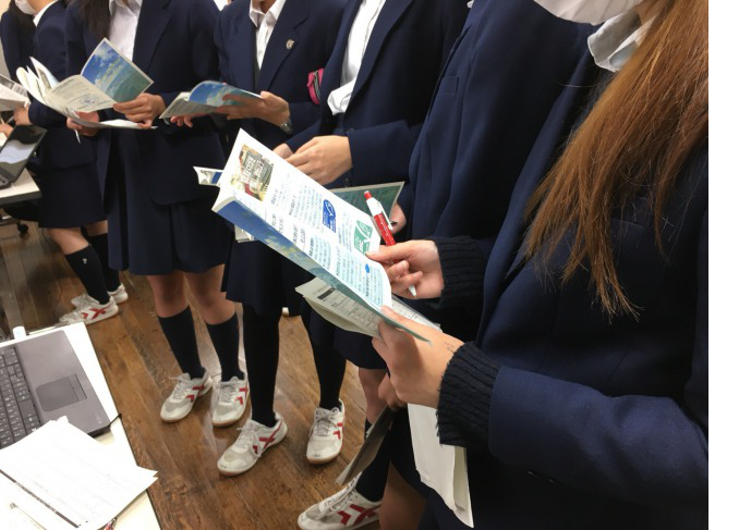 Showing our website and distribution the leaflet to the students.